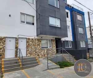 a building with stairs in front of it at Aima II in Ushuaia