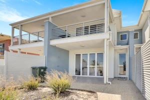 a house with a balcony in front of it at 96B Esplanade, Semaphore in Semaphore
