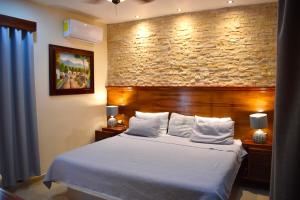 Postel nebo postele na pokoji v ubytování El Zaguán Colonial by GuruHotel