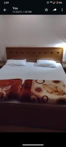 Posteľ alebo postele v izbe v ubytovaní OYO Benmore