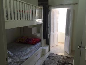 a childs room with a bunk bed and a staircase at Babylon guesthouse in Aswan