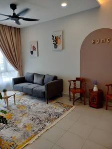 a living room with a couch and a table at Tamu @ Ostia Bangi in Bangi