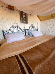 A bed or beds in a room at Live the bedouinlife