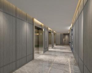 a hallway with a row of elevators in a building at Marriott Executive Apartments, Penang in George Town