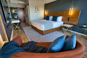 Postel nebo postele na pokoji v ubytování SOHO Hotel Auckland