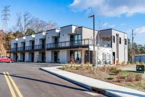 a large white building on the side of a street at Modern and Convenient Norwood Knox in Knoxville