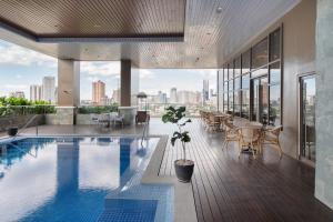 a pool on the roof of a building at Citadines Roces Quezon City in Manila