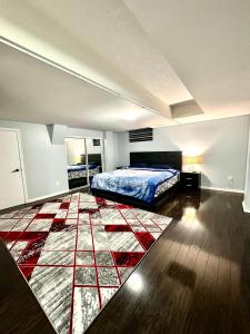 a bedroom with a bed and a rug at Golden Spring Beautiful home in Brampton