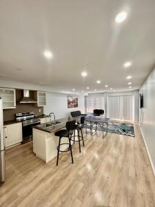 an empty kitchen and dining area of a apartment at Golden Spring Beautiful home in Brampton