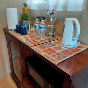 a counter top with a coffee maker on it at Stargazing Retreats in Camp Verde