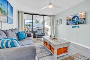 a living room with a couch and a table at 2BR in Key largo w pool and sunset views in Key Largo