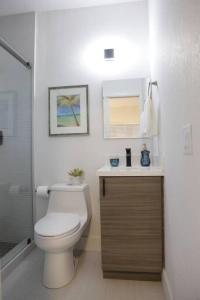 a bathroom with a toilet and a sink at Apt 6 Miami Designer Studio in the Upper East-Side in Miami