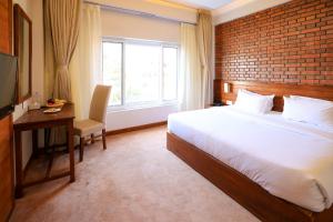 מיטה או מיטות בחדר ב-Hotel Dolmaling