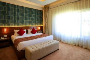 מיטה או מיטות בחדר ב-Hotel Dolmaling