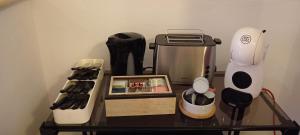 a counter with a coffee maker and a blender at G&G Giusy e Gabry in Santhià +30 photos