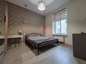 Postel nebo postele na pokoji v ubytování Duży komfortowy apartament w samym centrum przy Manufaktura i Piotrkowska, blisko ZOO, Fala
