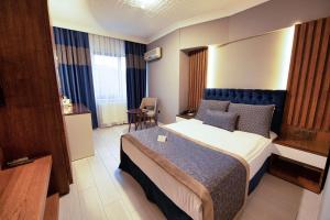 Postel nebo postele na pokoji v ubytování Vela Verde Hotel & SPA
