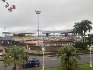 a blue car parked in front of a stadium at Manaeva L3 in Papeete