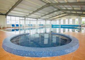 a large swimming pool with a large pool at C-Scape Lodge in Newquay