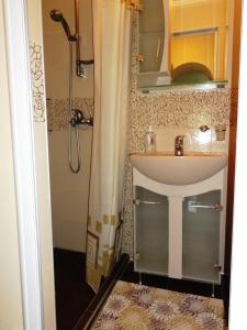 a bathroom with a sink and a shower at Villa Detelina Balchik in Balchik