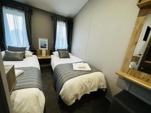 Postel nebo postele na pokoji v ubytování C-Scape Lodge + 36 fotografií
