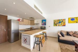 a kitchen and a living room with a couch at El Gouna Luxury flat on the pool in El Gouna