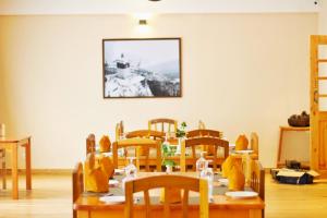 a dining room with a table and chairs at Paro Eco Lodge in Paro