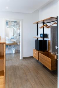 a room with a wooden dresser and a mirror at Dimora EFFE - Eco B&B in Termoli