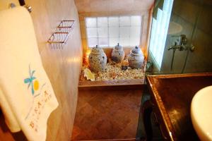 a room with a group of vases on the floor at Boracay Beach Houses in Boracay