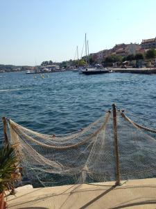 a net on the side of a body of water at Casa Svalba in Rovinj