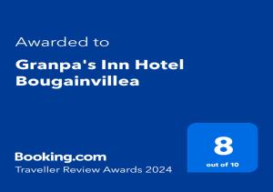 a screenshot of a cell phone with the text awarded to grandpas inn hotel at Granpa's Inn Hotel Bougainvillea in Anjuna