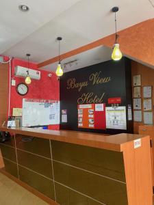 a restaurant with a happy new world sign on the wall at Bayu View Hotel Klang in Klang