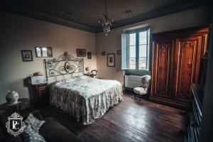 Postel nebo postele na pokoji v ubytování Palazzo Capparucci - Dimora storica