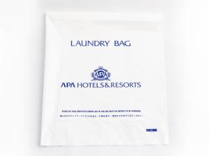 a catalogue of the laundry agency of australia with a white document at APA Hotel Tottori Ekimae Minami in Tottori