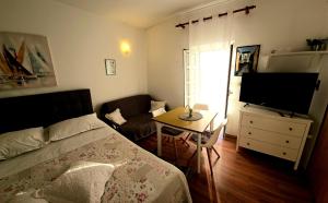Posteľ alebo postele v izbe v ubytovaní Viktorija Apartments