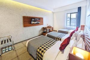 Voodi või voodid majutusasutuse THE 1O1 Bandung Dago toas