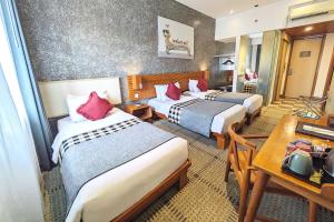 Voodi või voodid majutusasutuse THE 1O1 Bandung Dago toas