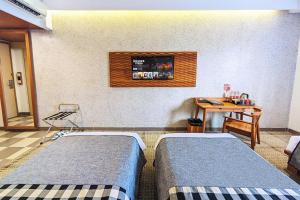 Voodi või voodid majutusasutuse THE 1O1 Bandung Dago toas