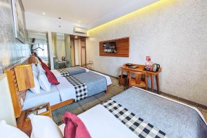 Voodi või voodid majutusasutuse THE 1O1 Bandung Dago toas