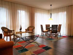 a living room with a table and chairs at Villa Maria 10 in Binz