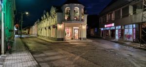 an empty street in a city at night at Apartment Natasa in Vršac