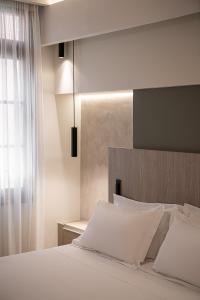 Ein Bett oder Betten in einem Zimmer der Unterkunft CASA DORINI