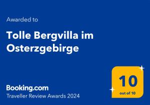 Ett certifikat, pris eller annat dokument som visas upp på Tolle Bergvilla im Osterzgebirge