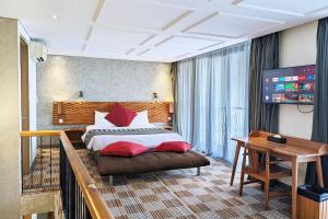 Voodi või voodid majutusasutuse THE 1O1 Bandung Dago toas