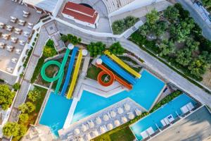 an overhead view of a water park with a pool at Lindos Royal Resort in Líndos