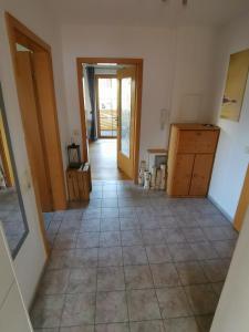 a hallway of a house with a tile floor at Im Ruhepol in Petting