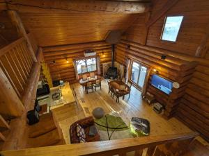 an overhead view of a living room and kitchen in a log cabin at Log cabin rental & Finland sauna Step House in Yamanakako