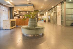 a lobby with a bench in the middle of a building at Modern Wellness Studio in Budapest