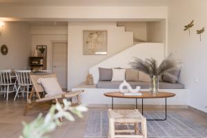a living room with a couch and a table at Magnolia Villas Potos Thassos in Potos