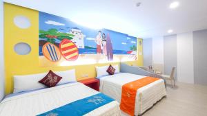 Rúm í herbergi á Ocean Star B&B